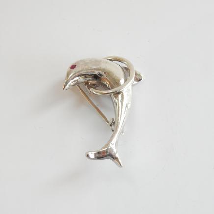Photo of Vintage Silver Ruby Dolphin Brooch