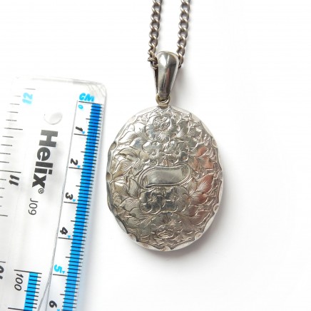 Photo of Antique Edwardian Silver Locket Necklace Hand Chased Oval Flower Locket