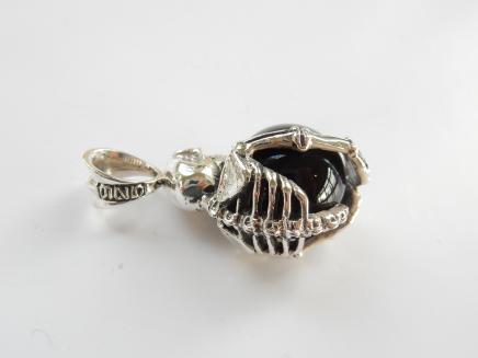 Photo of Solid Silver Skeleton Clutching Globe Pendant