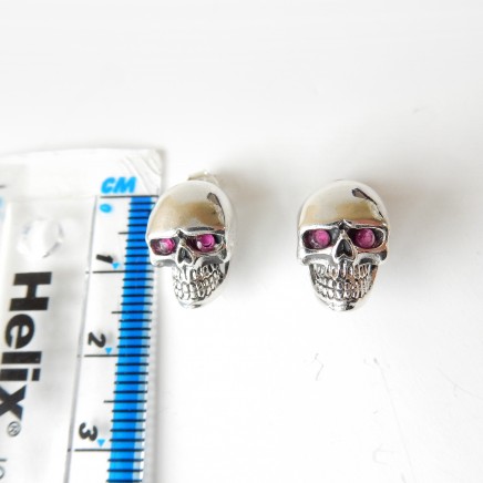 Photo of Sterling Silver Ruby Skull Stud Earrings