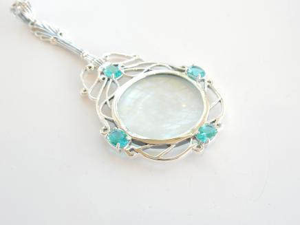 Photo of Solid Silver Blue Topaz Magnifying Glass Pendant