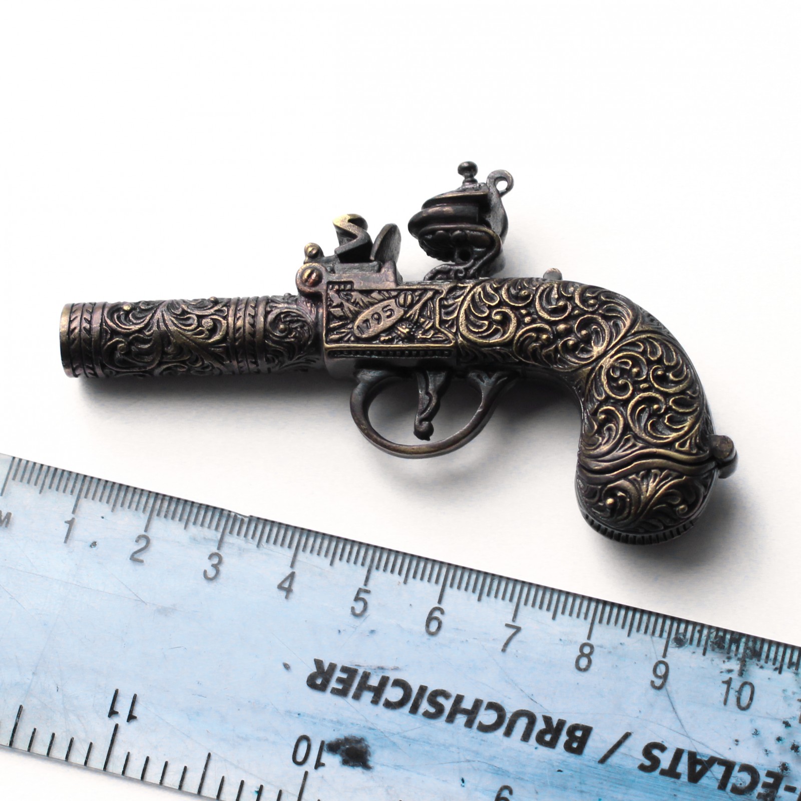 Photo of Novelty Brass Embossed Pistol Vesta